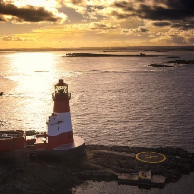 a boat on a beach near a body of water